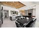 Spacious dining room with modern lighting, sleek table, and seamless connection to the open-concept kitchen at 10641 E Blue Sky Dr, Scottsdale, AZ 85262