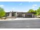 Beautiful single-story home boasts a modern design, multi-car garage and desert landscaping at 10641 E Blue Sky Dr, Scottsdale, AZ 85262