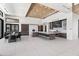 Spacious modern kitchen with a large island, sleek cabinetry, and stainless steel appliances under a striking wood ceiling at 10641 E Blue Sky Dr, Scottsdale, AZ 85262