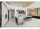Bright, open kitchen with large island and seating, stainless steel appliances, and modern lighting at 10641 E Blue Sky Dr, Scottsdale, AZ 85262