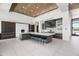 Bright, open kitchen with a large central island, contemporary lighting, and sleek appliances, perfect for modern living at 10641 E Blue Sky Dr, Scottsdale, AZ 85262