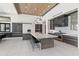 Bright, open kitchen featuring a large island with seating, modern appliances, and stylish pendant lighting at 10641 E Blue Sky Dr, Scottsdale, AZ 85262