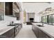 Open-concept kitchen boasts marble countertops, stainless steel appliances, and seamless flow to the living area at 10641 E Blue Sky Dr, Scottsdale, AZ 85262