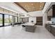 Open kitchen and dining area featuring a marble island, pendant lighting, and access to a pool view at 10641 E Blue Sky Dr, Scottsdale, AZ 85262