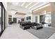Open living space with glass-enclosed wine room, tile floors, cozy seating and lots of sunlight at 10641 E Blue Sky Dr, Scottsdale, AZ 85262