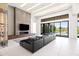 Spacious living room offering sleek decor, modern fireplace, tile floors, and inviting seating space at 10641 E Blue Sky Dr, Scottsdale, AZ 85262
