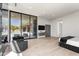 Spacious main bedroom view of backyard pool, accent fireplace, and minimalist design at 10641 E Blue Sky Dr, Scottsdale, AZ 85262