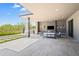 Outdoor living area includes a large patio, built-in BBQ, a seating area, and access to the backyard at 10641 E Blue Sky Dr, Scottsdale, AZ 85262