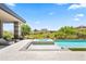 Backyard pool and spa with desert landscaping, a covered patio, and views of a nearby golf course at 10641 E Blue Sky Dr, Scottsdale, AZ 85262
