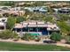Contemporary home with a sparkling pool, covered patio, and lush desert landscaping at 10641 E Blue Sky Dr, Scottsdale, AZ 85262