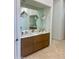Modern bathroom featuring a dual-sink vanity with marble countertop and stylish pendant lights at 10821 E Troon North Dr, Scottsdale, AZ 85262