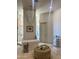 Luxurious bathroom with freestanding tub, glass shower, chandelier, and elegant finishes at 10821 E Troon North Dr, Scottsdale, AZ 85262
