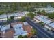 Aerial view of a residential area with lush landscaping, golf course, and a pond, creating a serene community at 11416 N Century Ln, Scottsdale, AZ 85254
