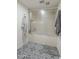Bathroom with enclosed shower featuring a frosted glass sliding door and stylish decorative tile floor at 11416 N Century Ln, Scottsdale, AZ 85254