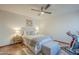 Bedroom with neutral decor, ceiling fan, and exercise bike setup at 11416 N Century Ln, Scottsdale, AZ 85254