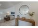 Bright foyer with a console table, decorative mirror and tiled floors that flow into the living room at 11416 N Century Ln, Scottsdale, AZ 85254