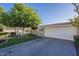 Home featuring a private gated entry, two car garage and well-maintained lawn with mature landscaping at 11416 N Century Ln, Scottsdale, AZ 85254
