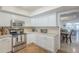Bright kitchen features stainless appliances, tile backsplash and lots of cabinet space at 11416 N Century Ln, Scottsdale, AZ 85254