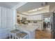 Bright kitchen features quartz countertops, stainless appliances, and breakfast bar at 11416 N Century Ln, Scottsdale, AZ 85254