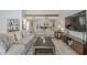 Bright living room features comfortable seating, a wooden beam, and lots of natural light at 11416 N Century Ln, Scottsdale, AZ 85254