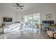 Bright living room with tile floors, comfortable seating and sliding glass doors at 11416 N Century Ln, Scottsdale, AZ 85254