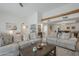Bright living room featuring comfortable seating and a rustic wooden beam at 11416 N Century Ln, Scottsdale, AZ 85254