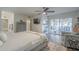 Bright main bedroom with ceiling fan, sitting area, and sliding glass door to outdoor space at 11416 N Century Ln, Scottsdale, AZ 85254