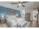 Inviting main bedroom with a large bed, ample lighting, and access to an en-suite bathroom at 11416 N Century Ln, Scottsdale, AZ 85254