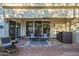 Relaxing covered patio with comfortable seating, an outdoor bar, and easy access through sliding glass doors at 11416 N Century Ln, Scottsdale, AZ 85254