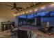 Cozy covered patio featuring comfortable seating, an outdoor bar, and ambient string lights creating a relaxing outdoor space at 11416 N Century Ln, Scottsdale, AZ 85254