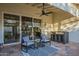 Inviting covered patio featuring comfortable seating, stylish decor, and seamless access to the interior through sliding glass doors at 11416 N Century Ln, Scottsdale, AZ 85254