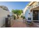 Private brick patio with grill, lounge chairs and a garden area, offering a perfect outdoor retreat at 11416 N Century Ln, Scottsdale, AZ 85254