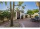 Private brick patio featuring a built-in grill, lounge chairs and garden area perfect for outdoor relaxation and entertaining at 11416 N Century Ln, Scottsdale, AZ 85254
