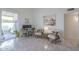 Cozy sitting area with comfortable chairs, an adjacent patio and neutral walls at 11416 N Century Ln, Scottsdale, AZ 85254