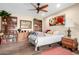 Relaxing bedroom with a bed, bookcases, and accent decor elements at 13889 N 108Th Dr, Sun City, AZ 85351