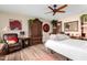 Cozy bedroom features a decorative armoire, accents, and a comfortable bed at 13889 N 108Th Dr, Sun City, AZ 85351
