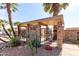 The community's desert landscaping with a gated entry, palm trees, and cactus at 13889 N 108Th Dr, Sun City, AZ 85351