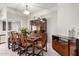 Dining room features wooden table and chairs, decorative cabinet, and stylish lighting at 13889 N 108Th Dr, Sun City, AZ 85351
