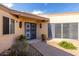 Inviting home exterior showcasing a secure screen door and desert-friendly landscaping at 13889 N 108Th Dr, Sun City, AZ 85351