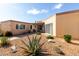 Single-story home featuring a low-maintenance desert-style landscape and covered entrance at 13889 N 108Th Dr, Sun City, AZ 85351