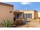 Single-story home featuring a low-maintenance desert-style landscape and covered entrance at 13889 N 108Th Dr, Sun City, AZ 85351