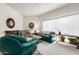 Bright living room featuring comfortable seating, fireplace, and natural light at 13889 N 108Th Dr, Sun City, AZ 85351