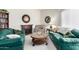 Cozy living room featuring neutral carpet, a fireplace, and comfortable seating at 13889 N 108Th Dr, Sun City, AZ 85351