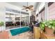 Connected office with a desk and sliding doors offering a view to the living room at 13889 N 108Th Dr, Sun City, AZ 85351