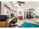 Well-lit office with work space, desk, and sliding doors offering bright natural light at 13889 N 108Th Dr, Sun City, AZ 85351