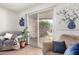 Cozy living area with comfortable seating and access to an outdoor patio at 13889 N 108Th Dr, Sun City, AZ 85351