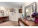 Charming vanity area with wood-look floors, artwork, and a makeup mirror at 13889 N 108Th Dr, Sun City, AZ 85351