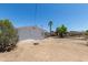 Spacious backyard with desert landscaping and partial views of the property at 1413 E Dobbins Rd, Phoenix, AZ 85042