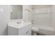 Bright bathroom with white vanity, mirror, toilet, and shower-tub combination at 1413 E Dobbins Rd, Phoenix, AZ 85042