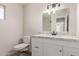 Bathroom featuring a vanity with a granite countertop and white cabinets at 1413 E Dobbins Rd, Phoenix, AZ 85042